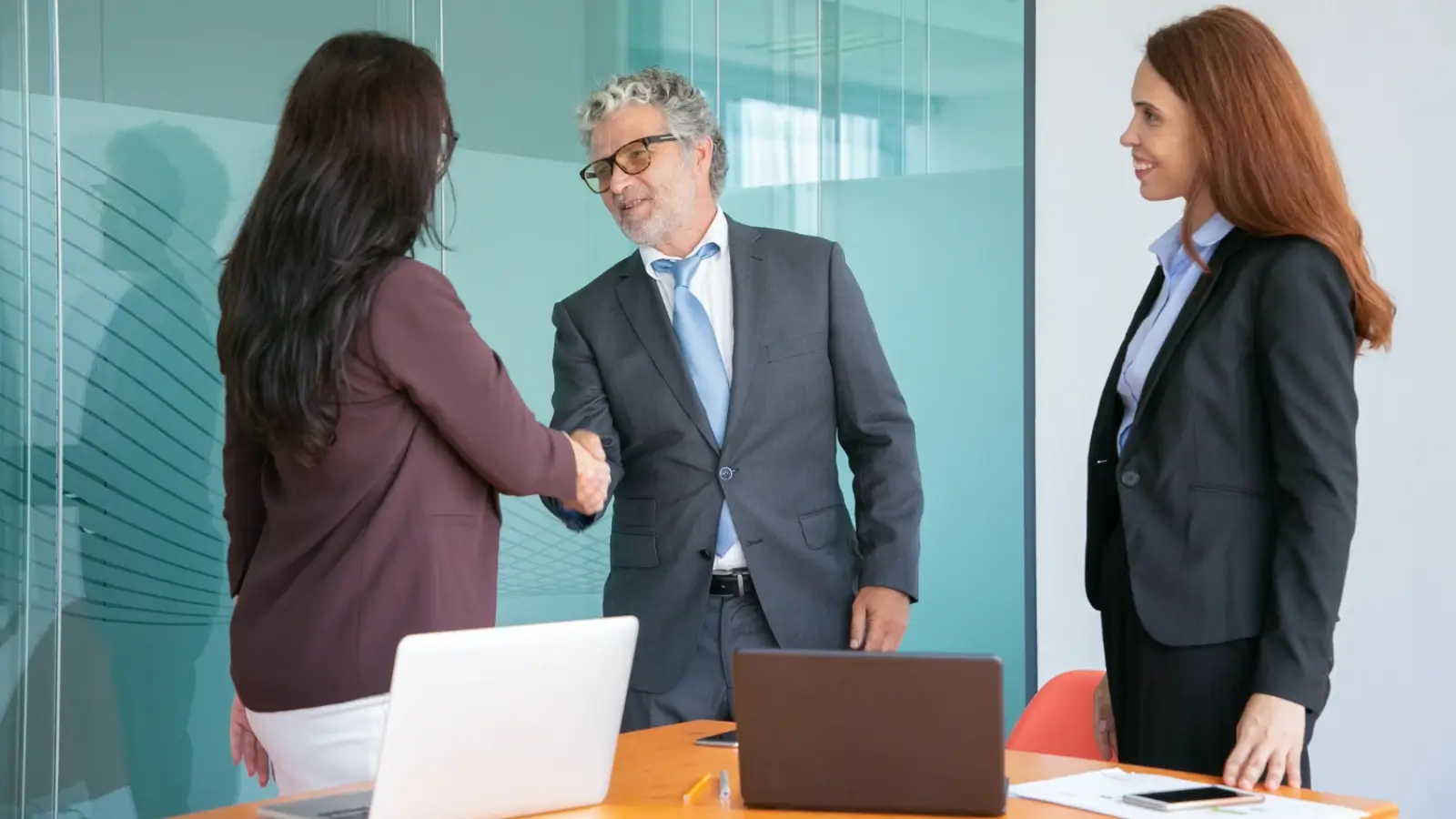 What to Expect When Working with a Business Broker Business broker guiding a client through buying or selling a business deal