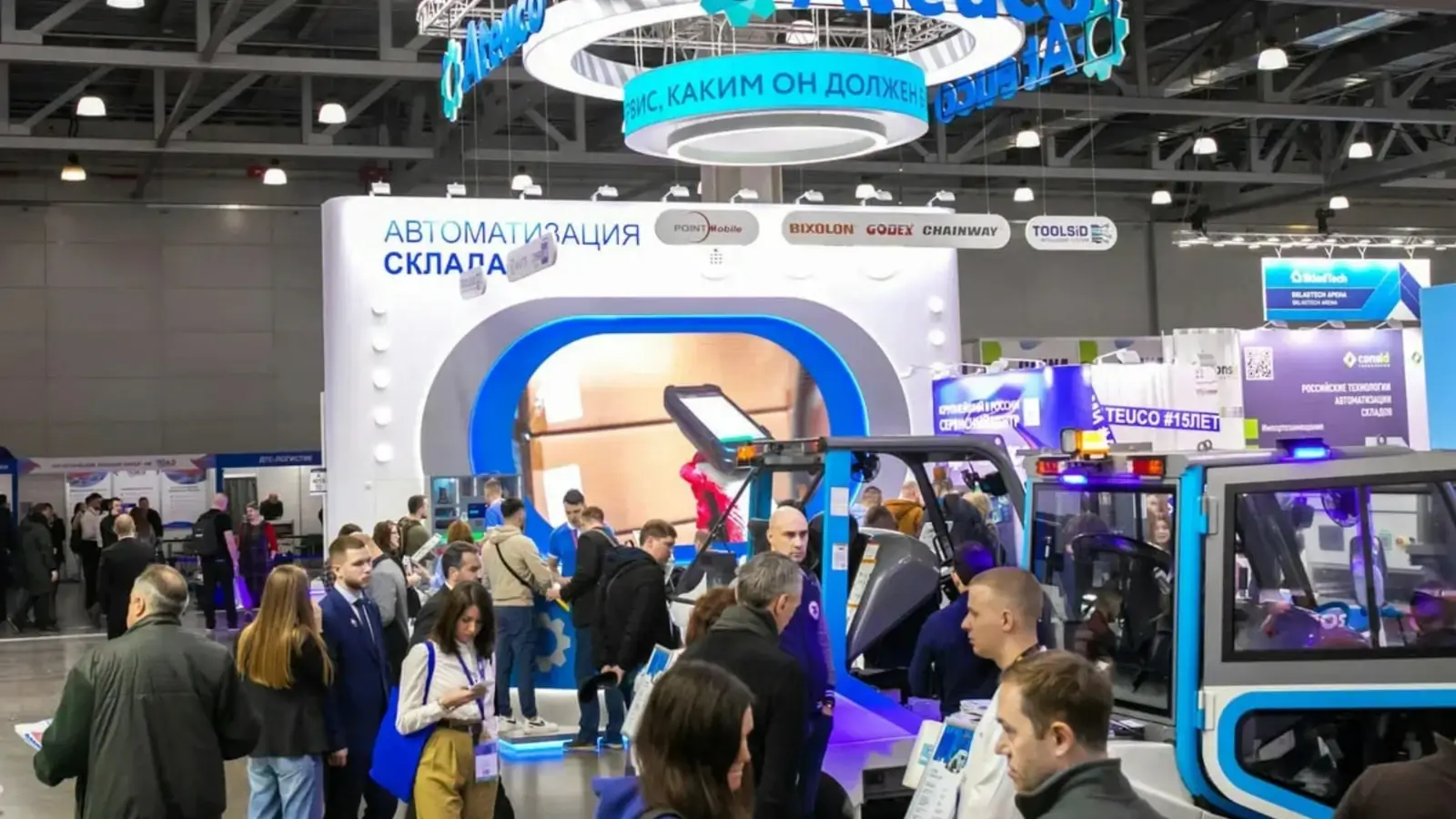 How You Can Make Your Brand More Visible Business owner displaying branded merchandise at a marketing event