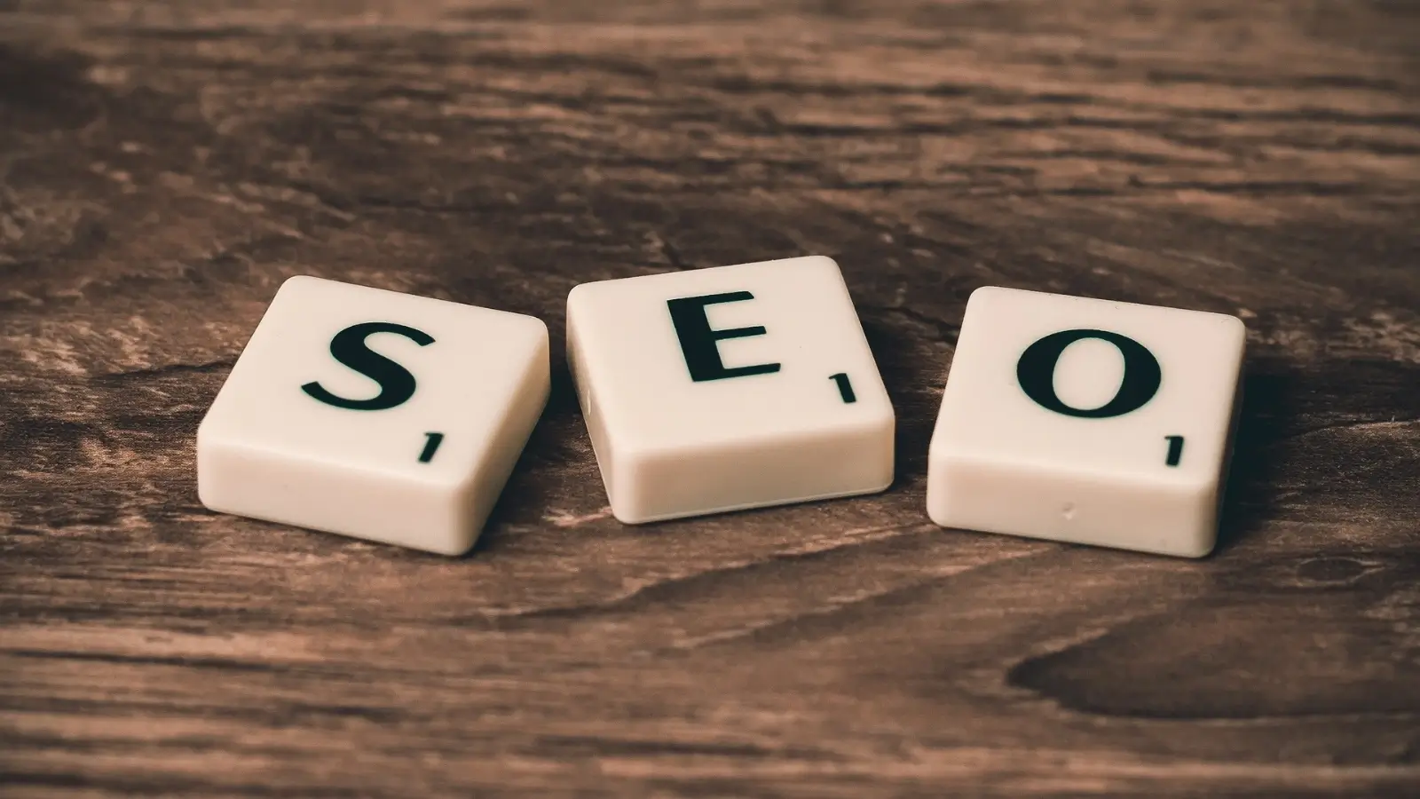 How Small Businesses Can Boost Visibility Online Business owner improving online visibility through website and social media