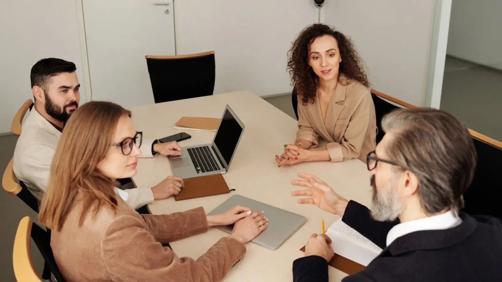 Business team managing product catalog on e-commerce platform with analytics dashboard