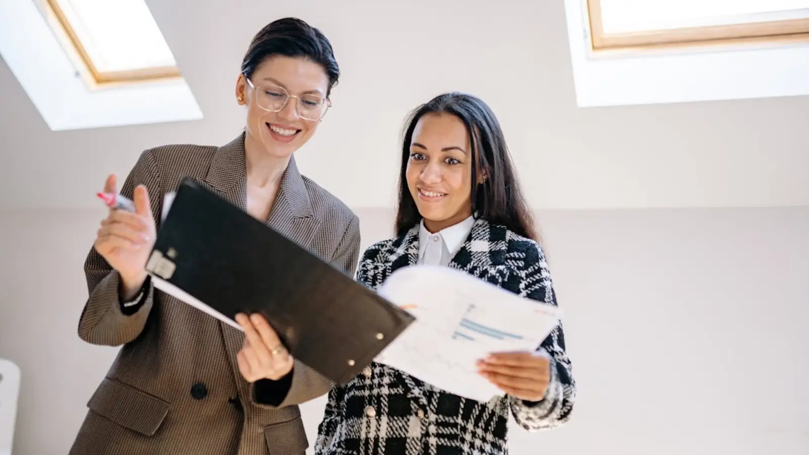 Buyers agent showing property options to homebuyers on the Gold Coast
