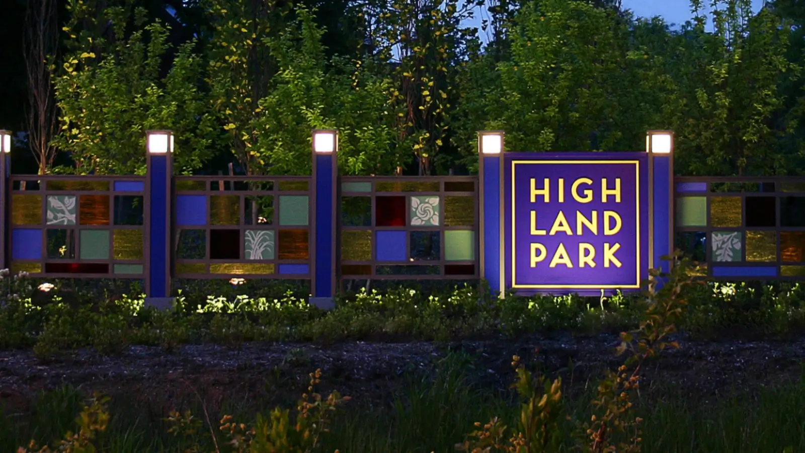 Colorful illuminated electrical signs lighting up Highland Park streets at night