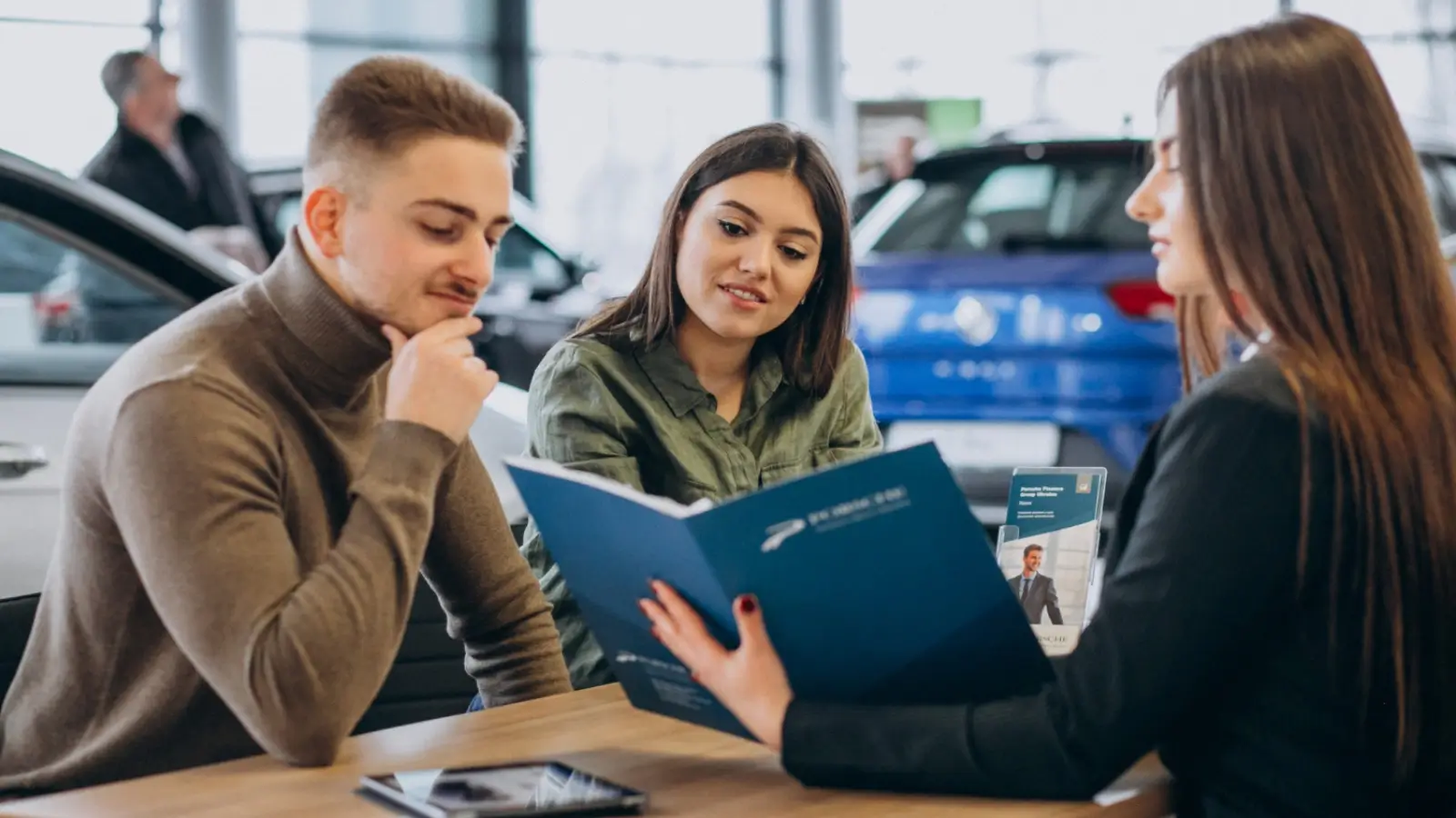 How to Finance a Used Car in Enid Customer reviewing financing options for a used car at a dealership in Enid, Oklahoma