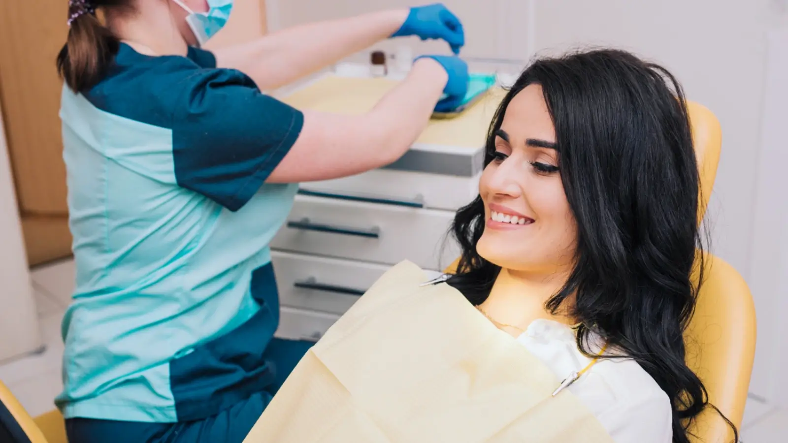 Dentist performing composite bonding procedure on patient in Newcastle clinic
