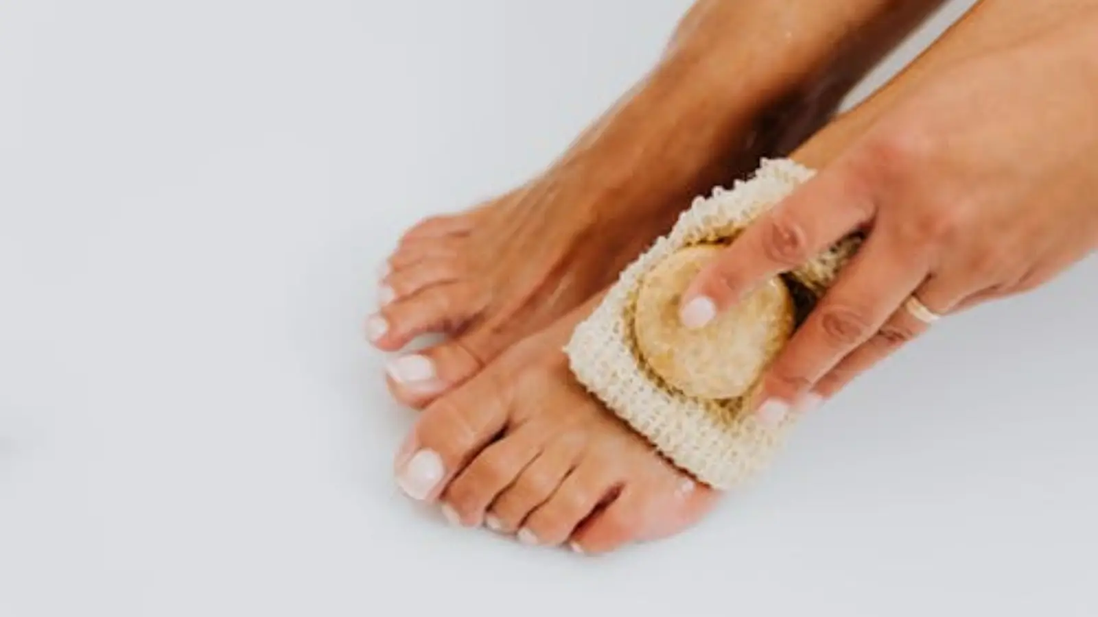 Doctor performing laser therapy on a patient's leg for varicose vein treatment