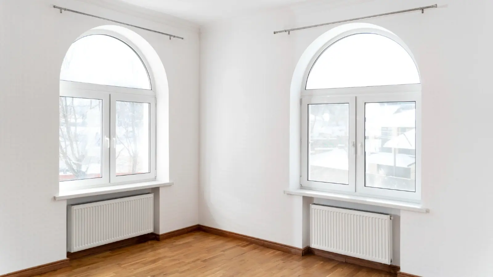 Elegant bow window installation in a Canadian home with natural light flooding the room