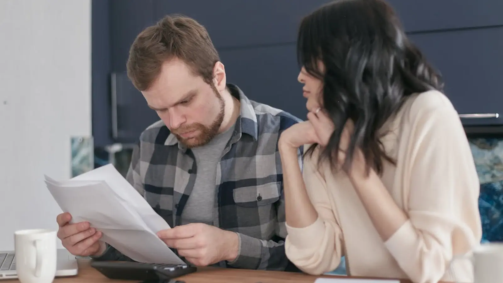 Family reviewing life insurance policy documents at home