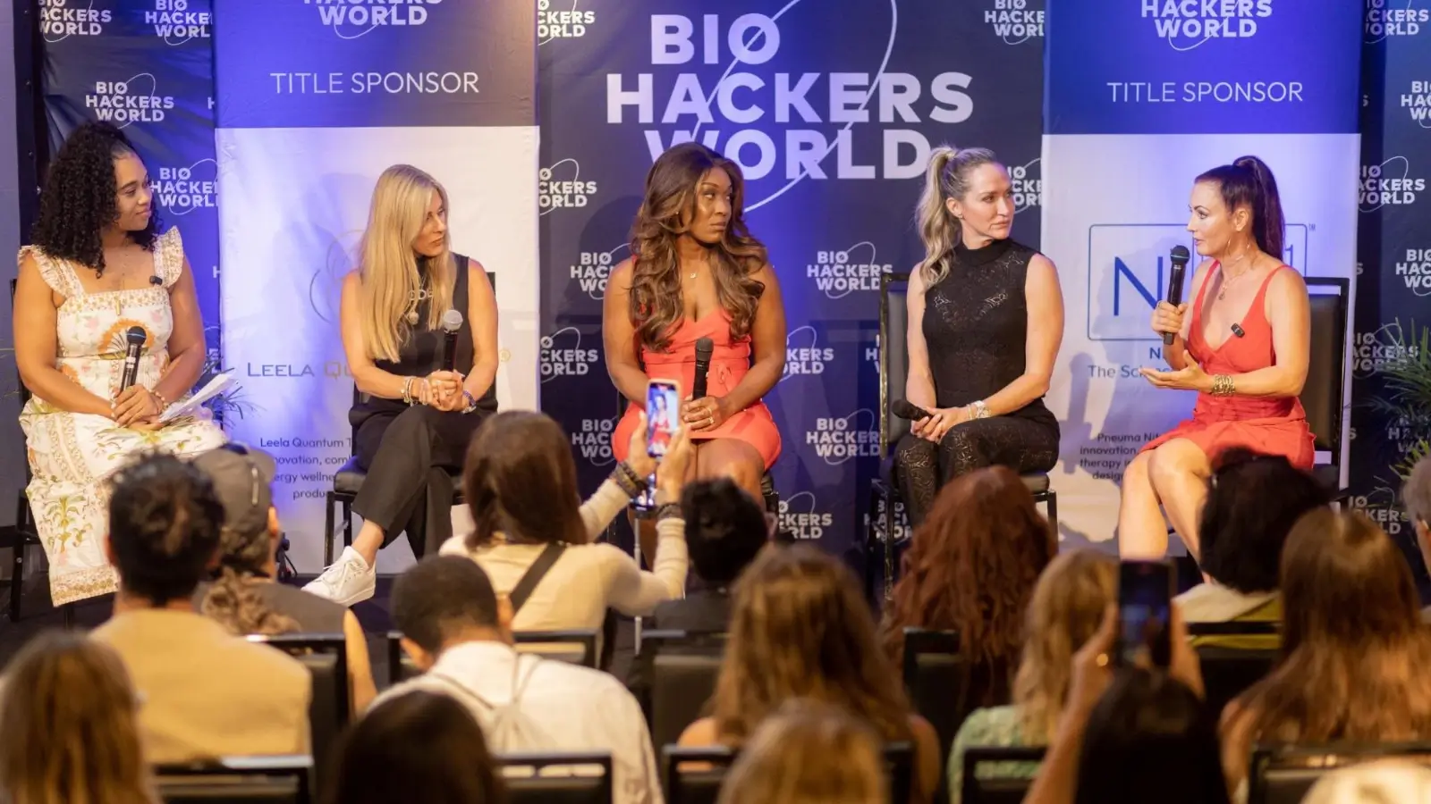 Female biohacker speaking on stage at Biohackers World 2025 in Miami