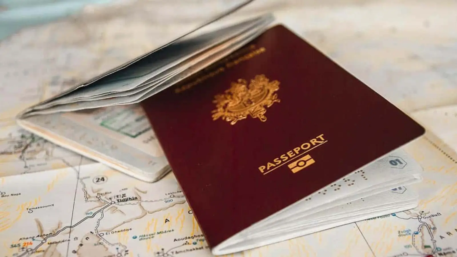 Wipgen Bridges the Gap Between Global Talent, Investment, and Residency Golden Visa passport and residency documents on a desk with international maps and investment plans