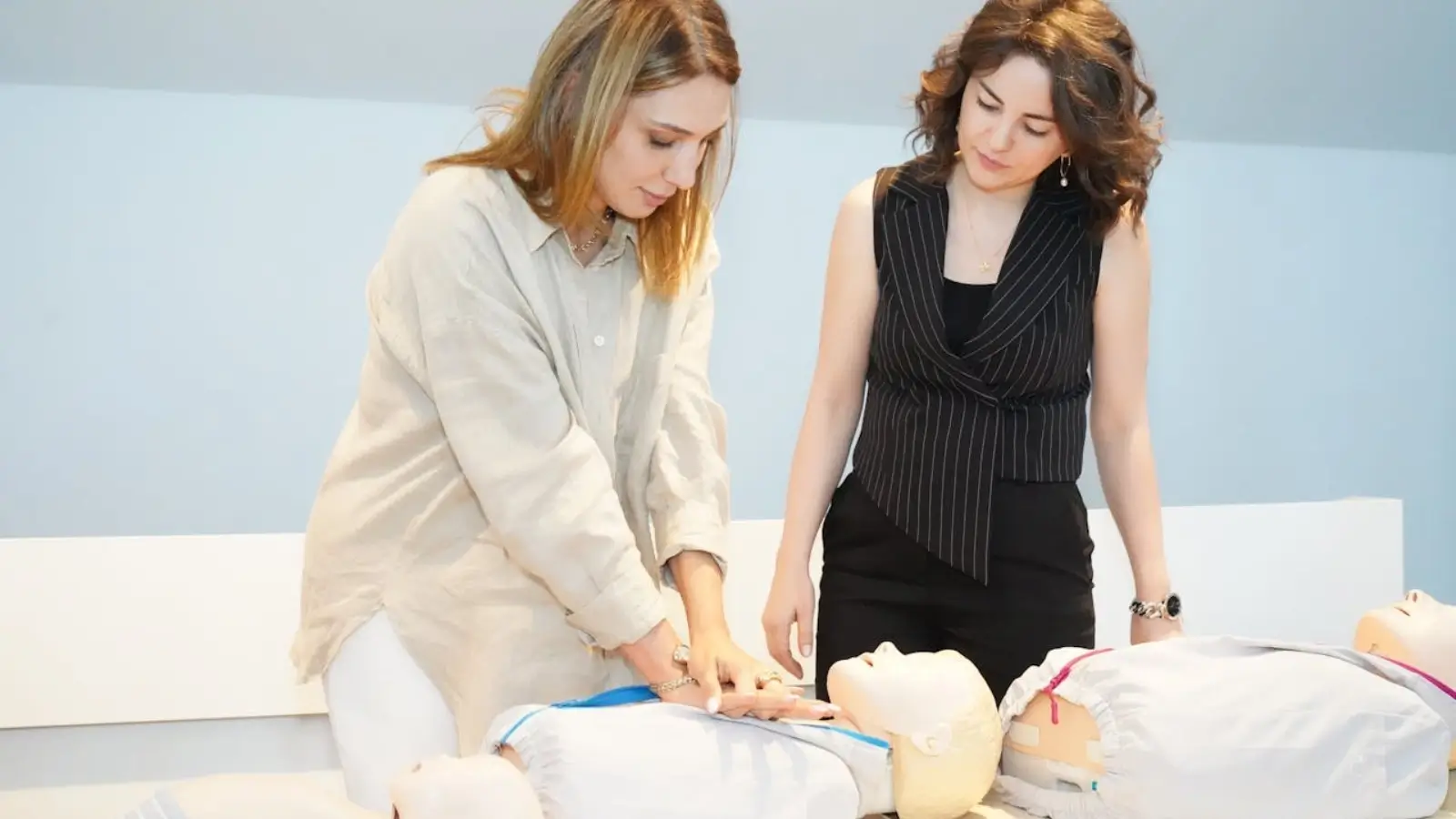 Healthcare professional practicing CPR during a BLS certification course in Oakland