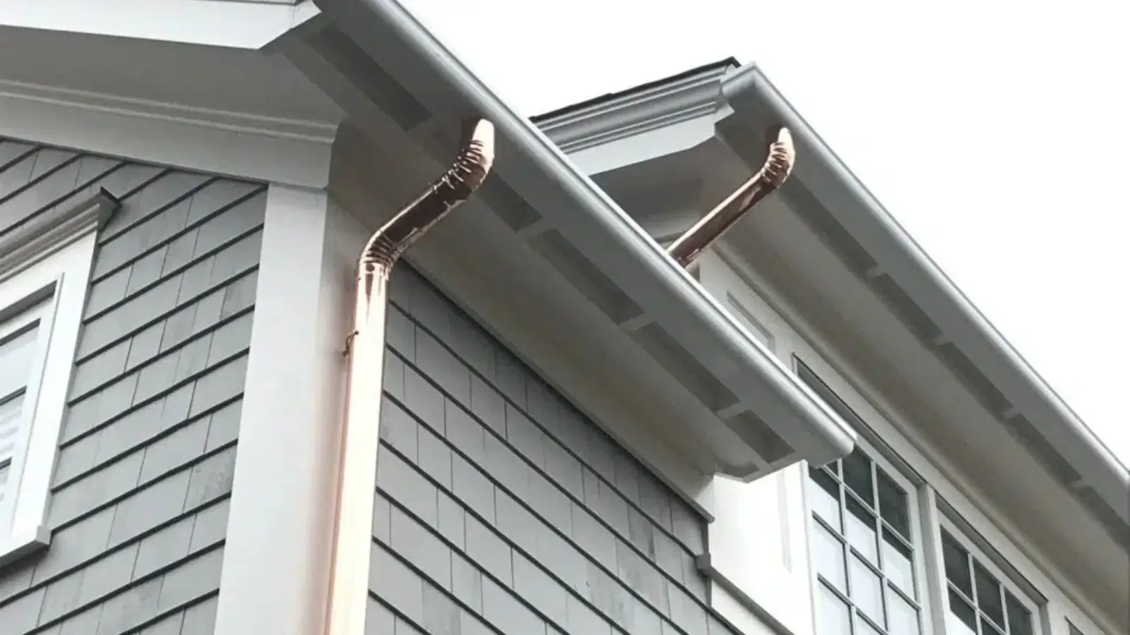 Home with professionally installed fiberglass gutters for durability and style