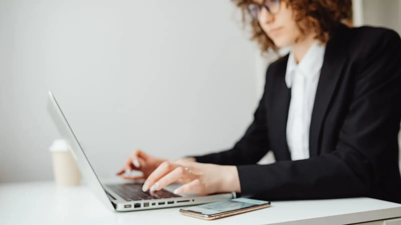 HR manager using employee engagement software on laptop