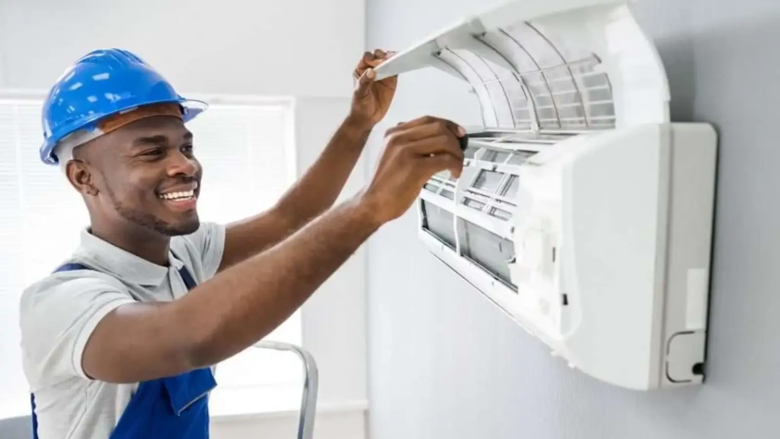 HVAC technician checking a home air conditioning unit on a sunny day