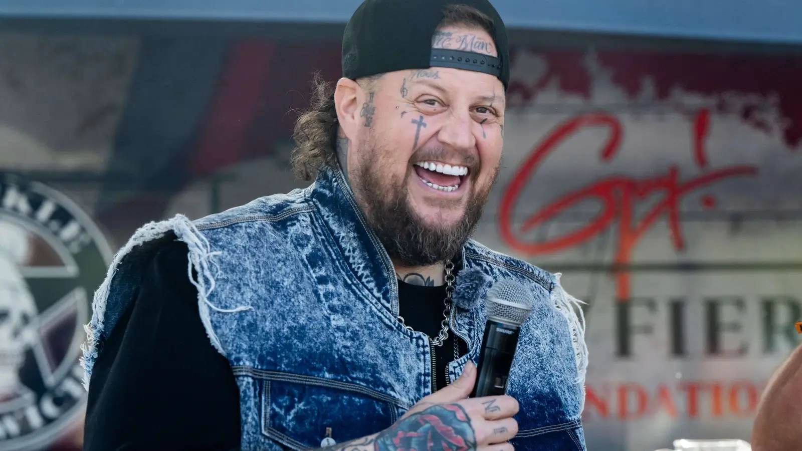 Jelly Roll standing outside his Nashville home, reflecting his grounded and family-focused lifestyle