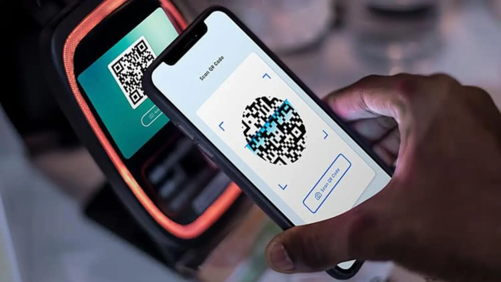 What Are Secure Digital Payment Solutions? Person making a secure digital payment using a mobile phone and fingerprint authentication