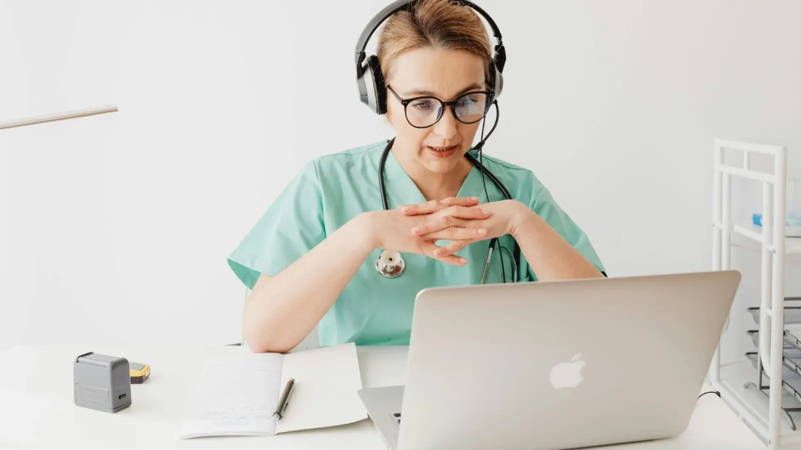 Physician using a mobile charge capture app during hospital rounds