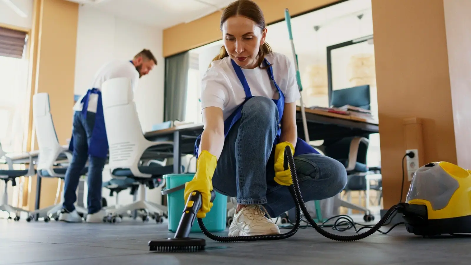 Professional cleaning team servicing a modern Minneapolis office with advanced equipment