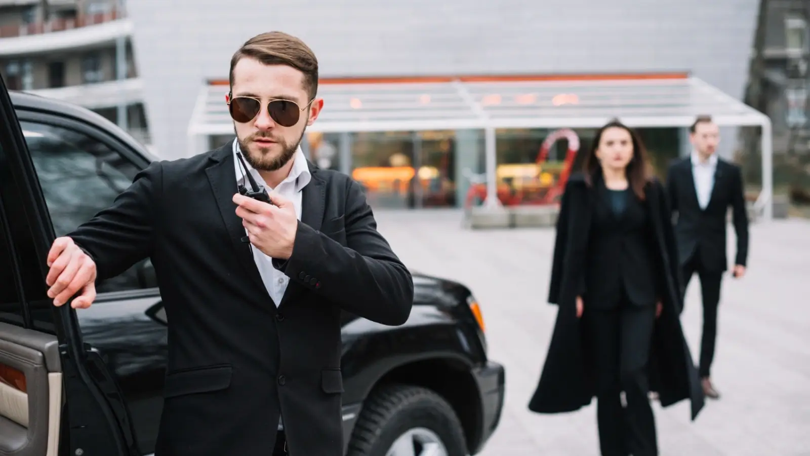 Professional executive protection agent providing discreet security for a business executive