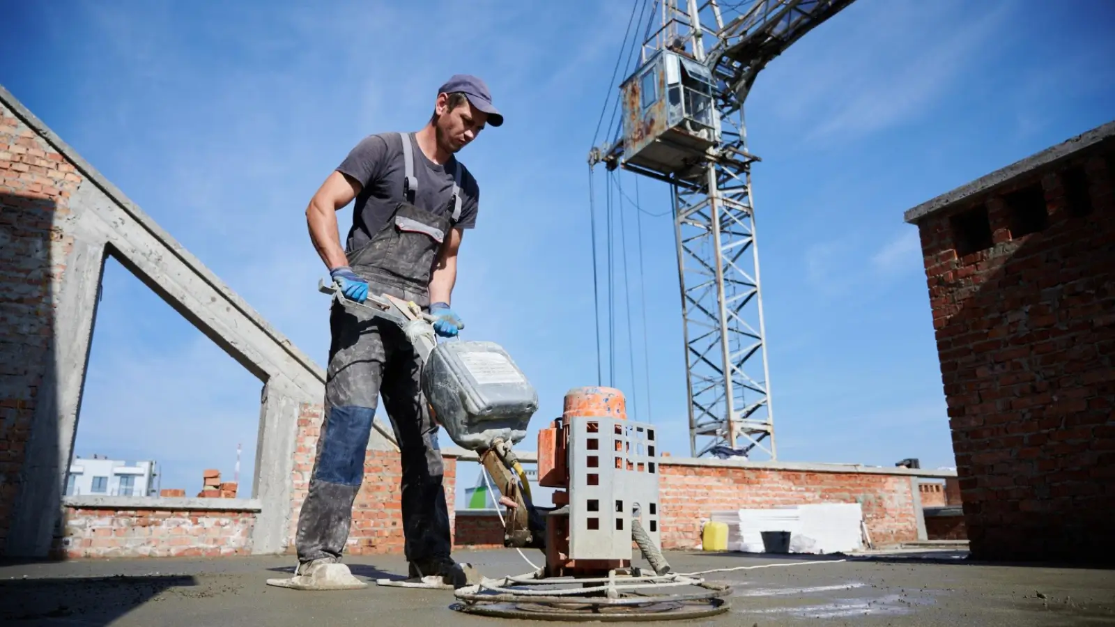 Professional using flooring equipment on a commercial job site