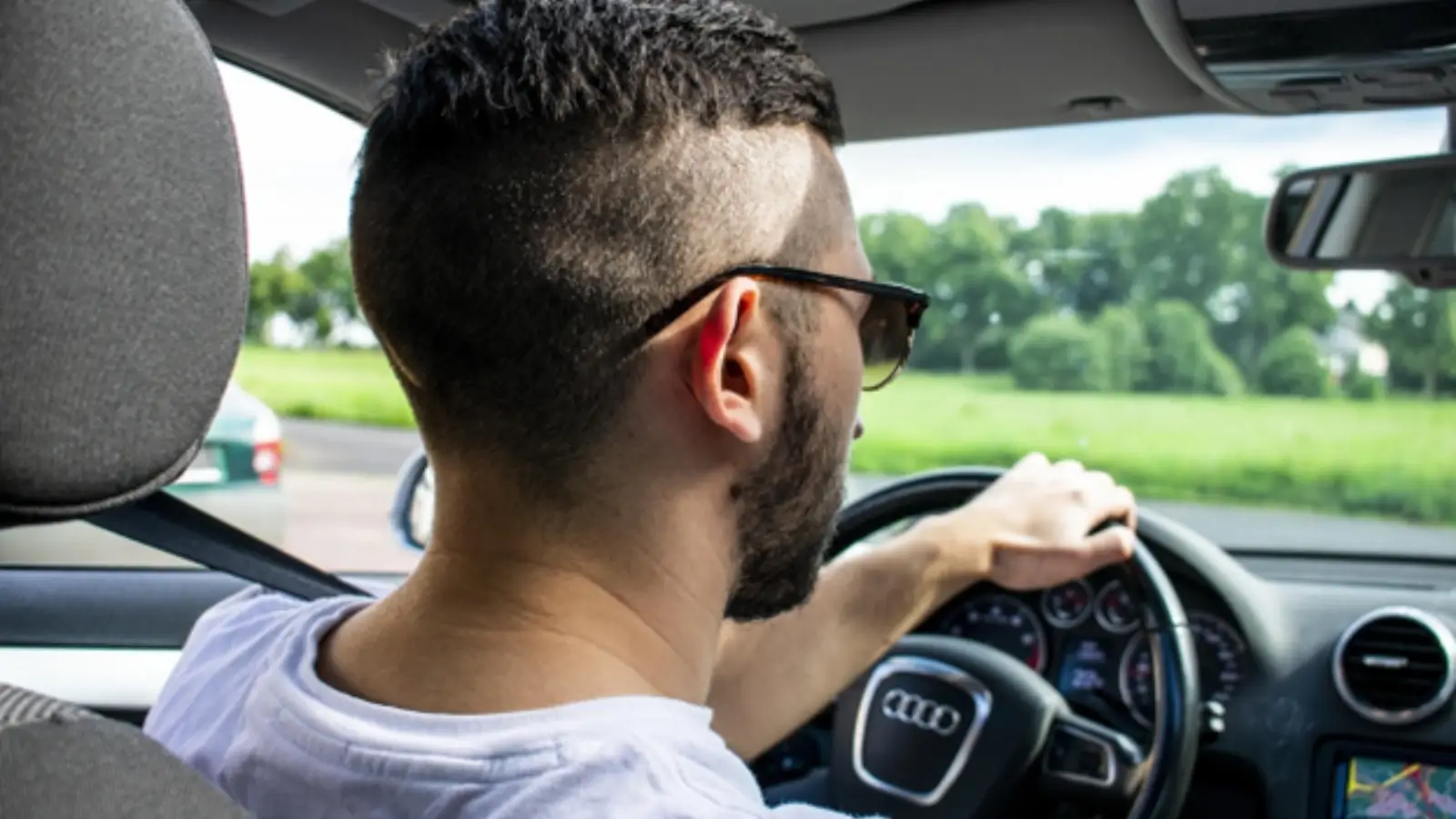 Sales professional using Carlinkit dashboard integration while driving