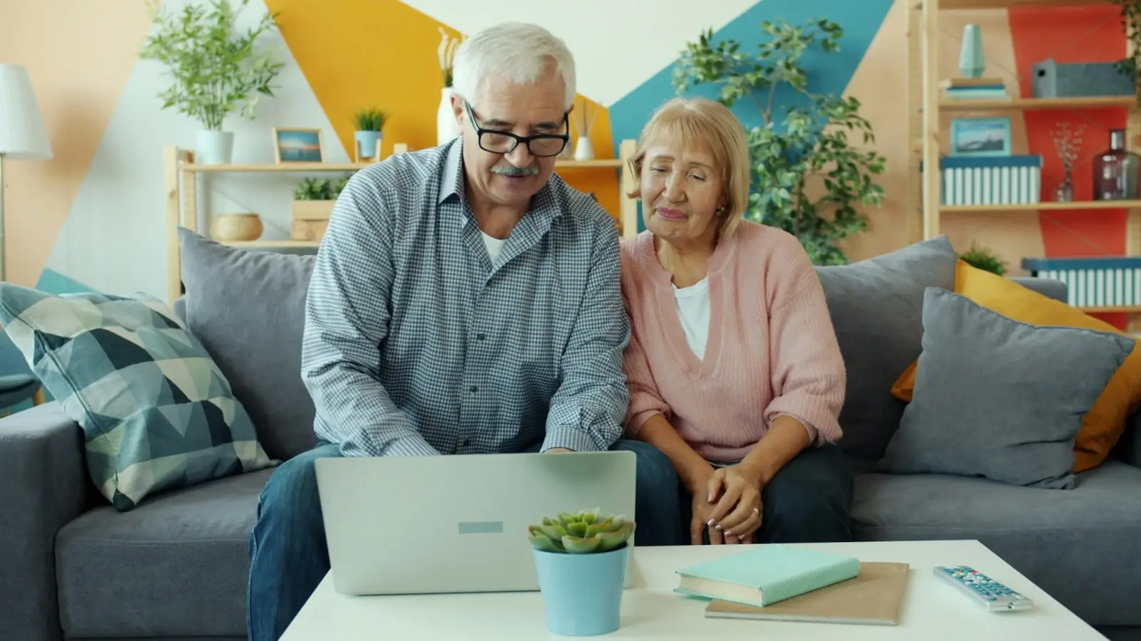 Senior couple reviewing Social Security retirement benefits on a tablet