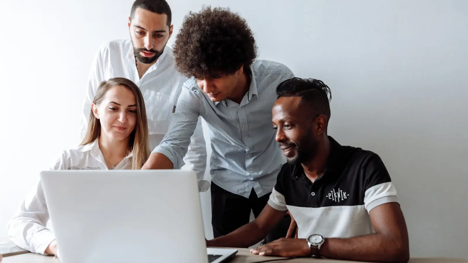 Small business owner consulting with outsourced IT provider about cybersecurity strategy