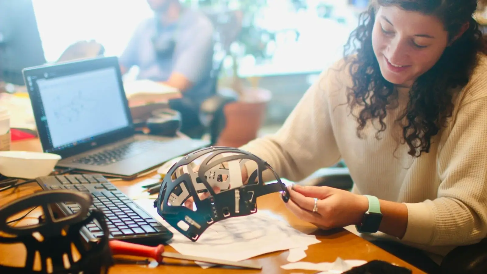 Cost-Effective Product Development for Startups Startup team reviewing product prototypes and manufacturing options