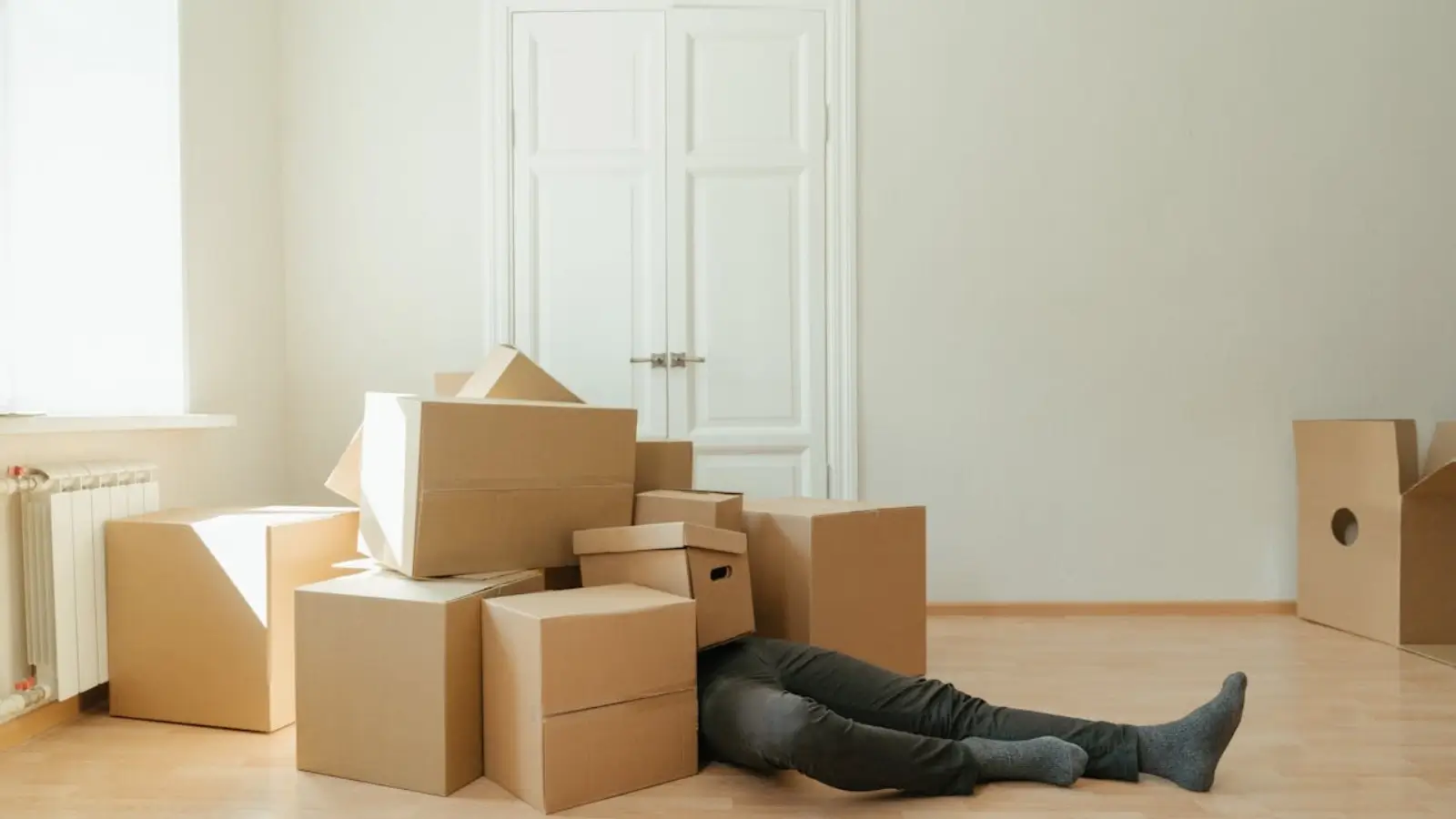 4 Places to Ask for Help With Your Commercial Move Team coordinating a corporate office relocation with moving boxes and IT equipment