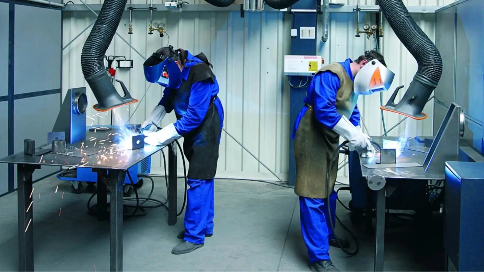 How Fume Extractor Arms Enhance Welding Efficiency Welding technician using a fume extractor arm in an industrial workshop