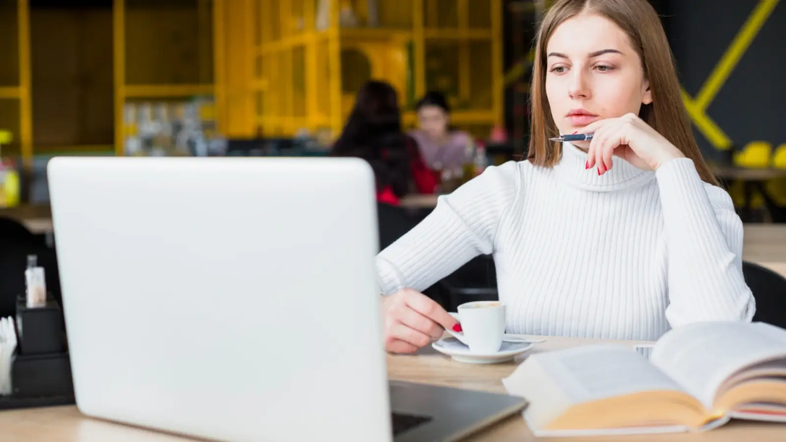 Working professional studying for CMA USA exam with laptop and notes