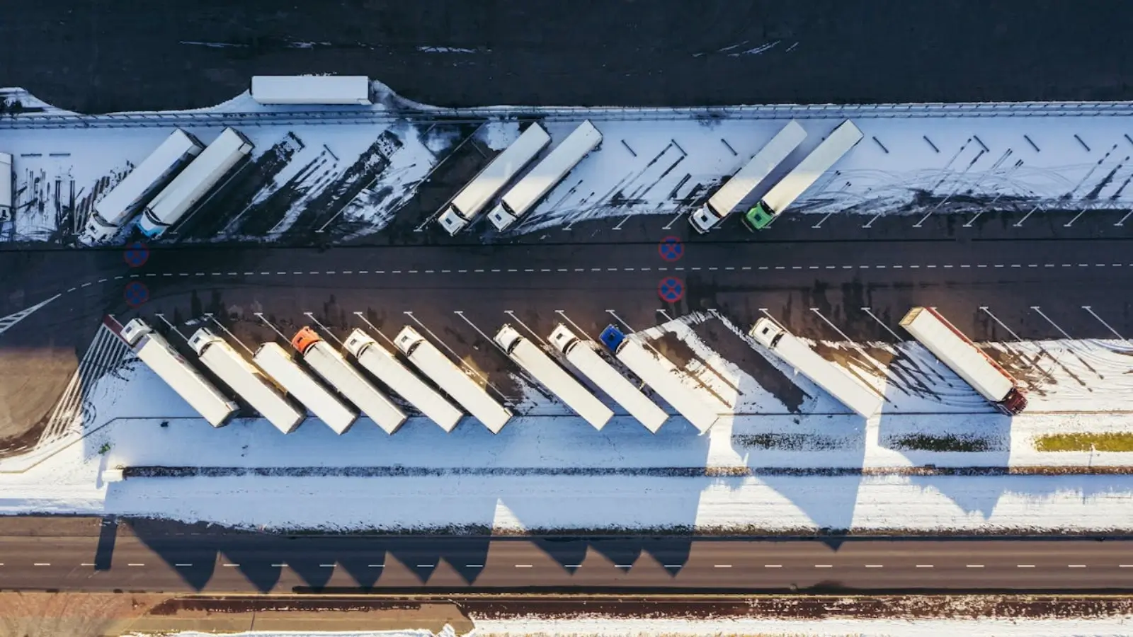 Aerial view of Truckspace Pompano Beach secure truck parking facility with trucks parked in wide, organized lanes