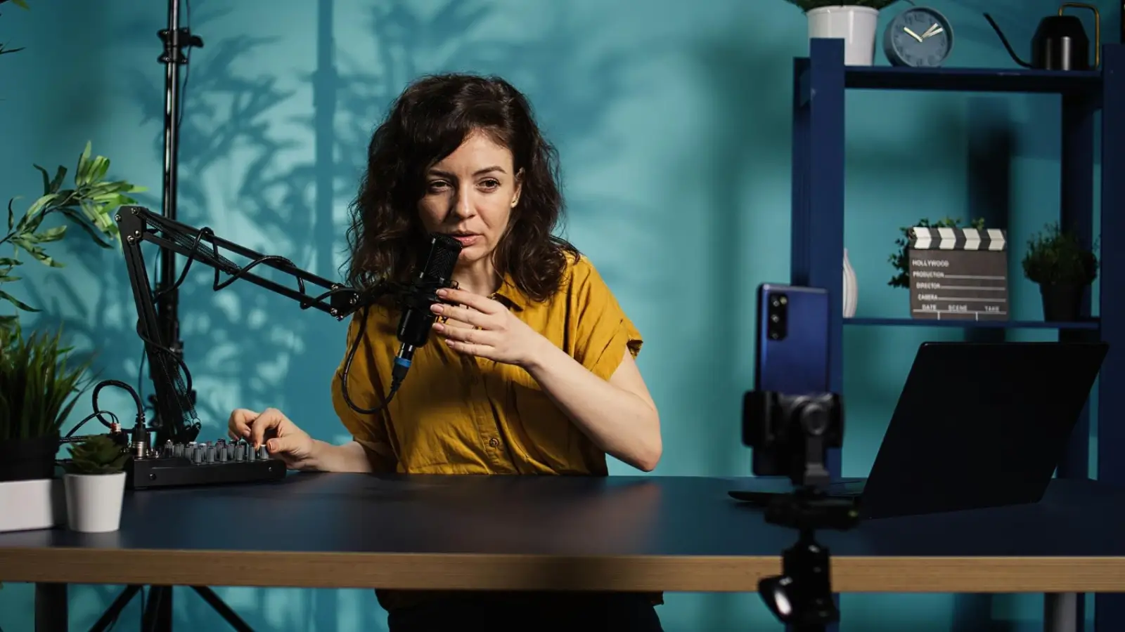 ASMR creator using binaural microphone to record whispering content in home studio