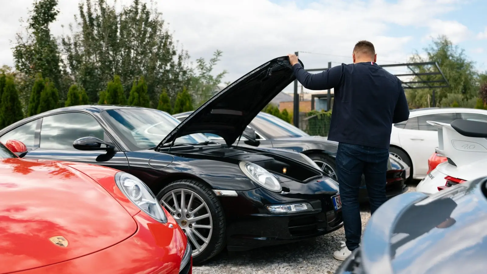 Auto business owner managing workshop tools and customer service in garage