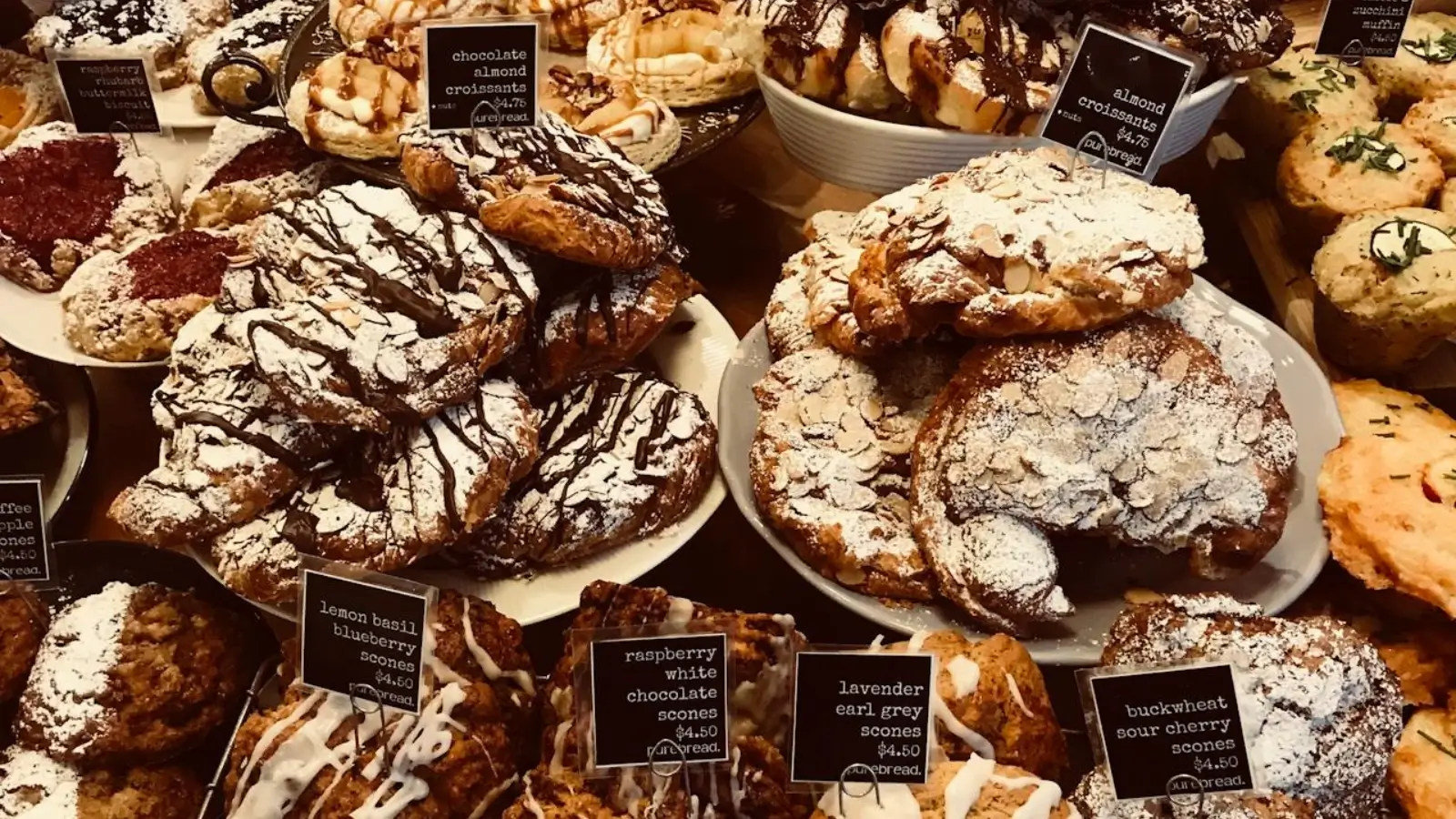 Bakery owner managing inventory and selling fresh baked goods