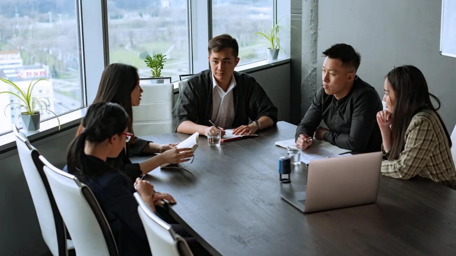 Business team discussing Odoo customization strategy in an office setting