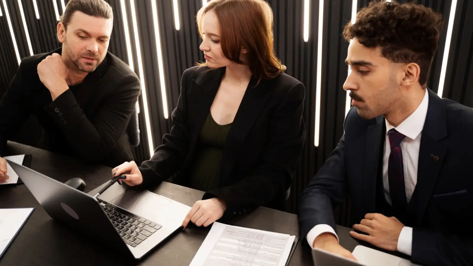 Corporate team consulting legal experts during a high-risk business situation