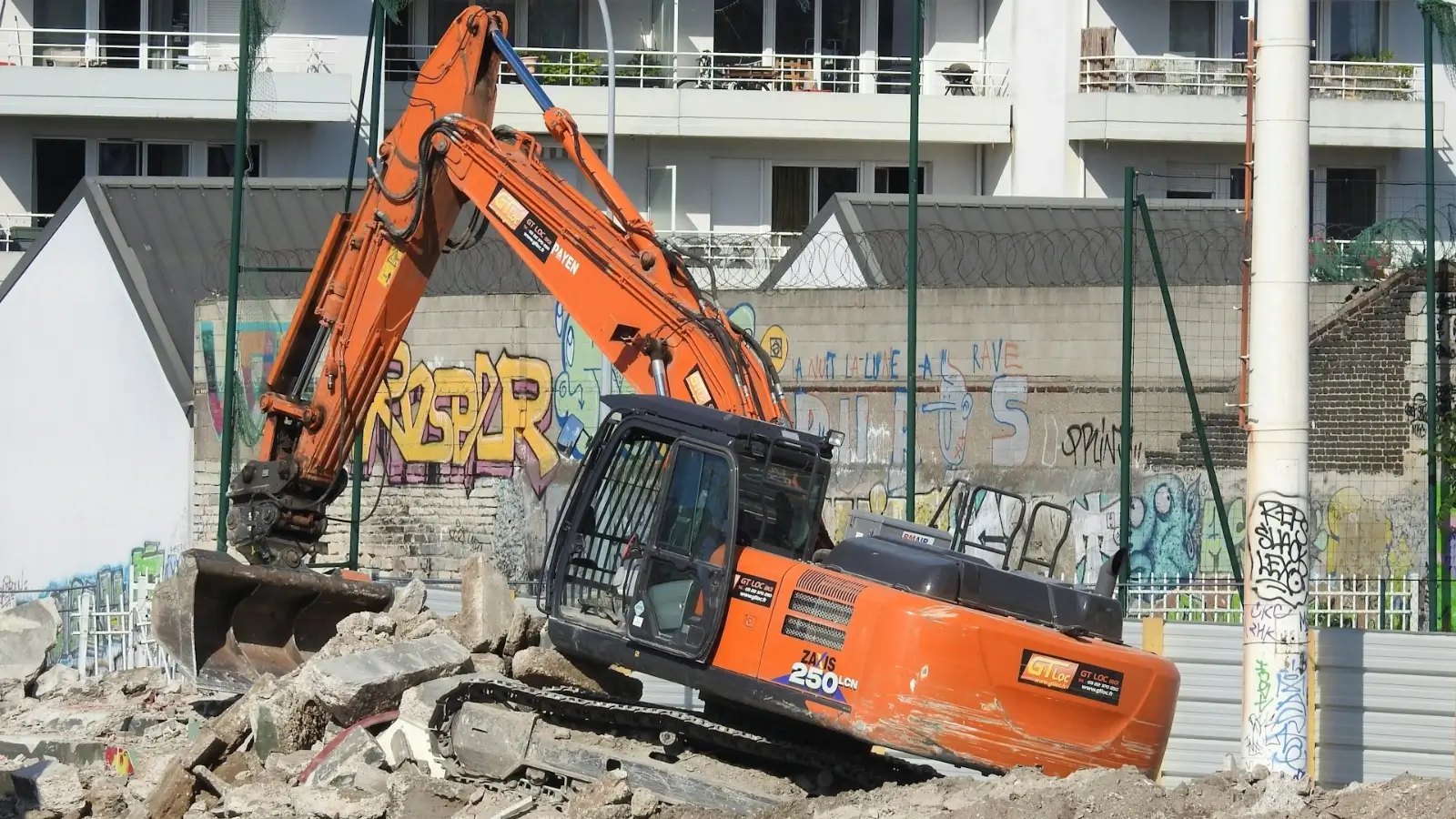 Demo Boyzz team using advanced demolition equipment on a residential teardown site