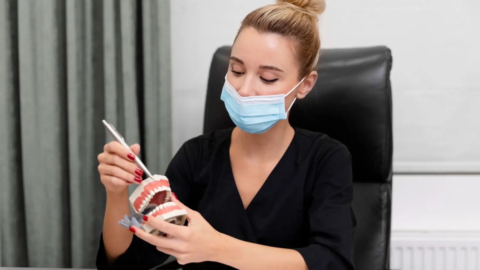 Dental implant care routine with toothbrush, floss, and model of teeth