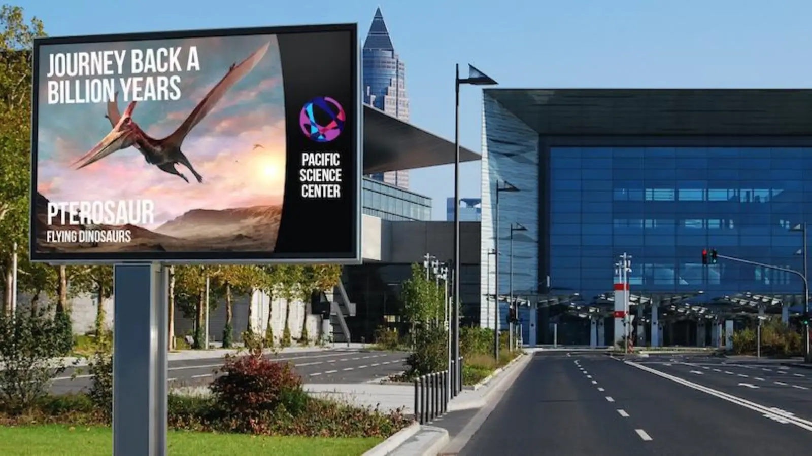 Digital time and temperature display with variable message sign on a busy city street