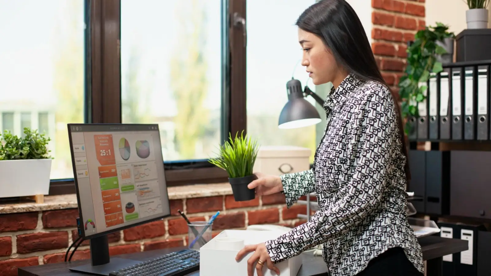 Employee using productivity software in a small business office