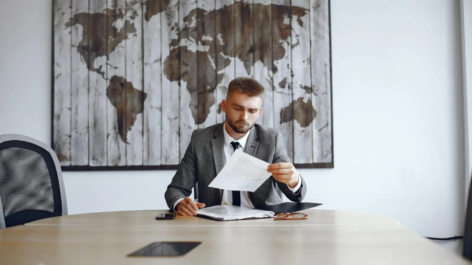 Entrepreneur reviewing business immigration documents for Canada with a translator