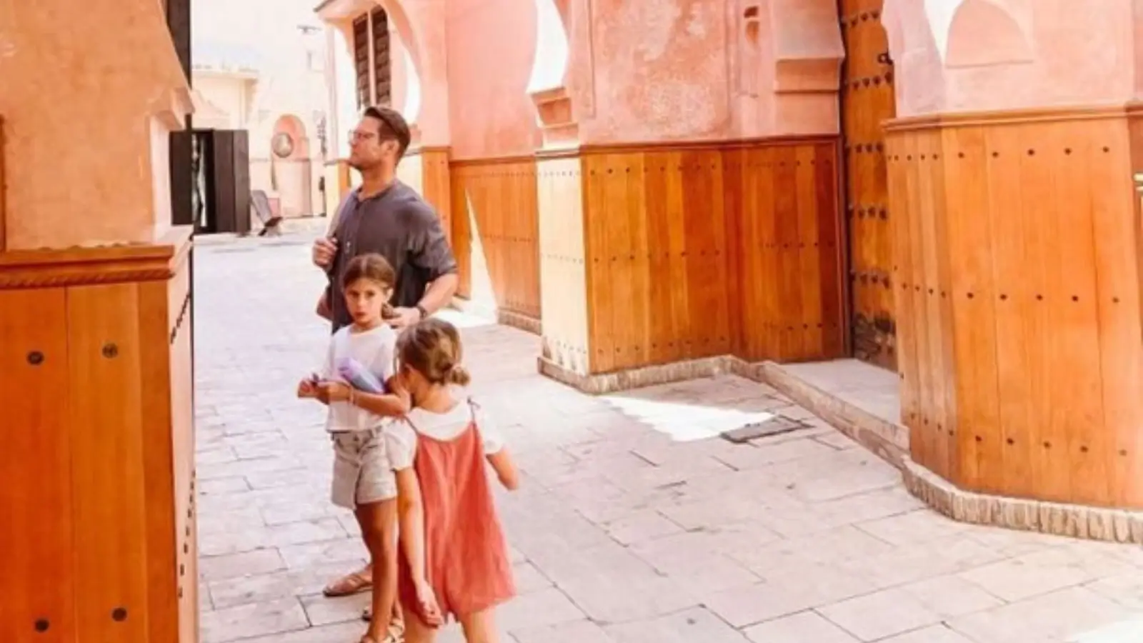 Family enjoying a camel ride through the Atlas Mountains during a luxury Morocco tour