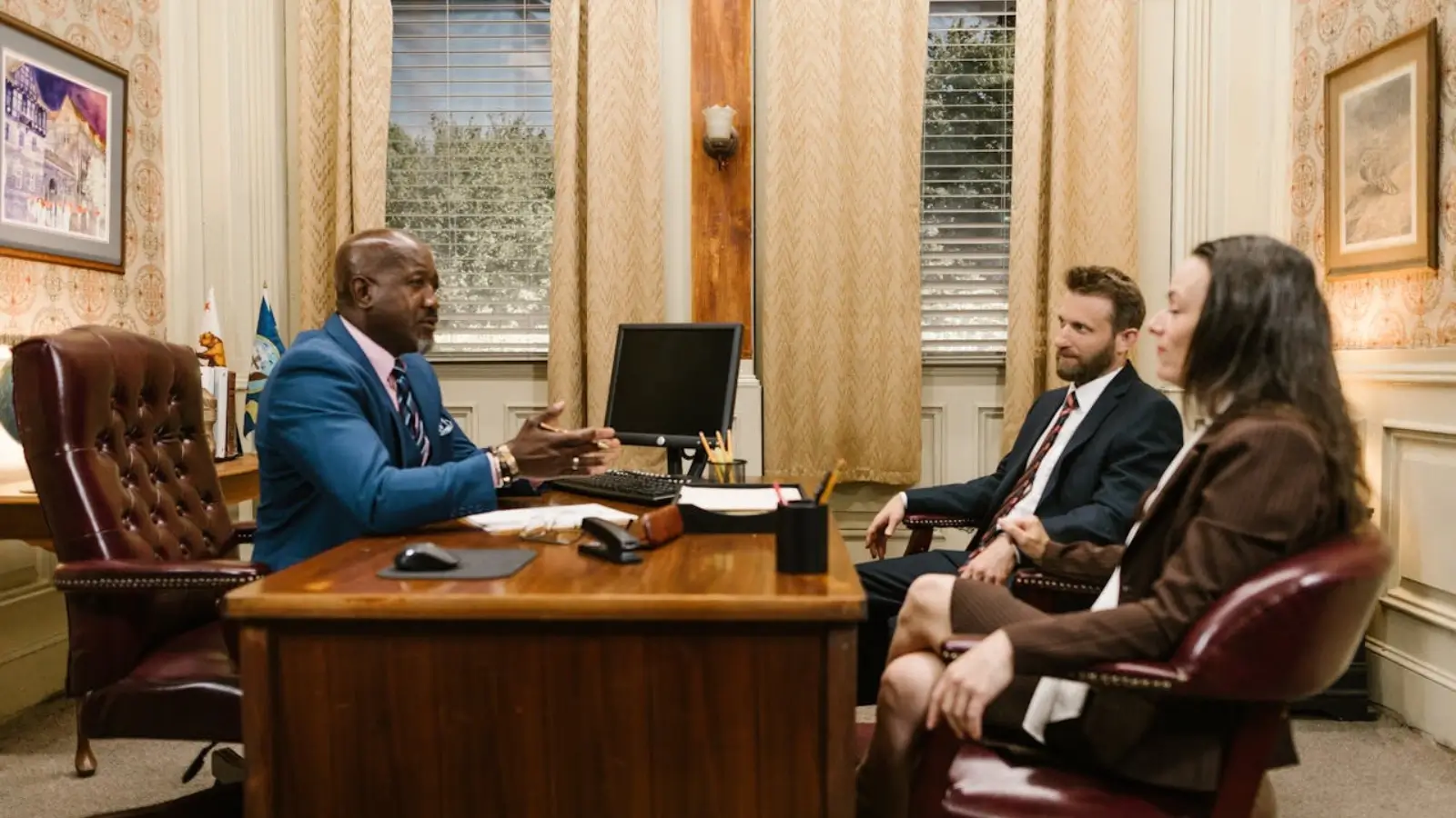 Family law attorney consulting with a client during a legal consultation in a professional office