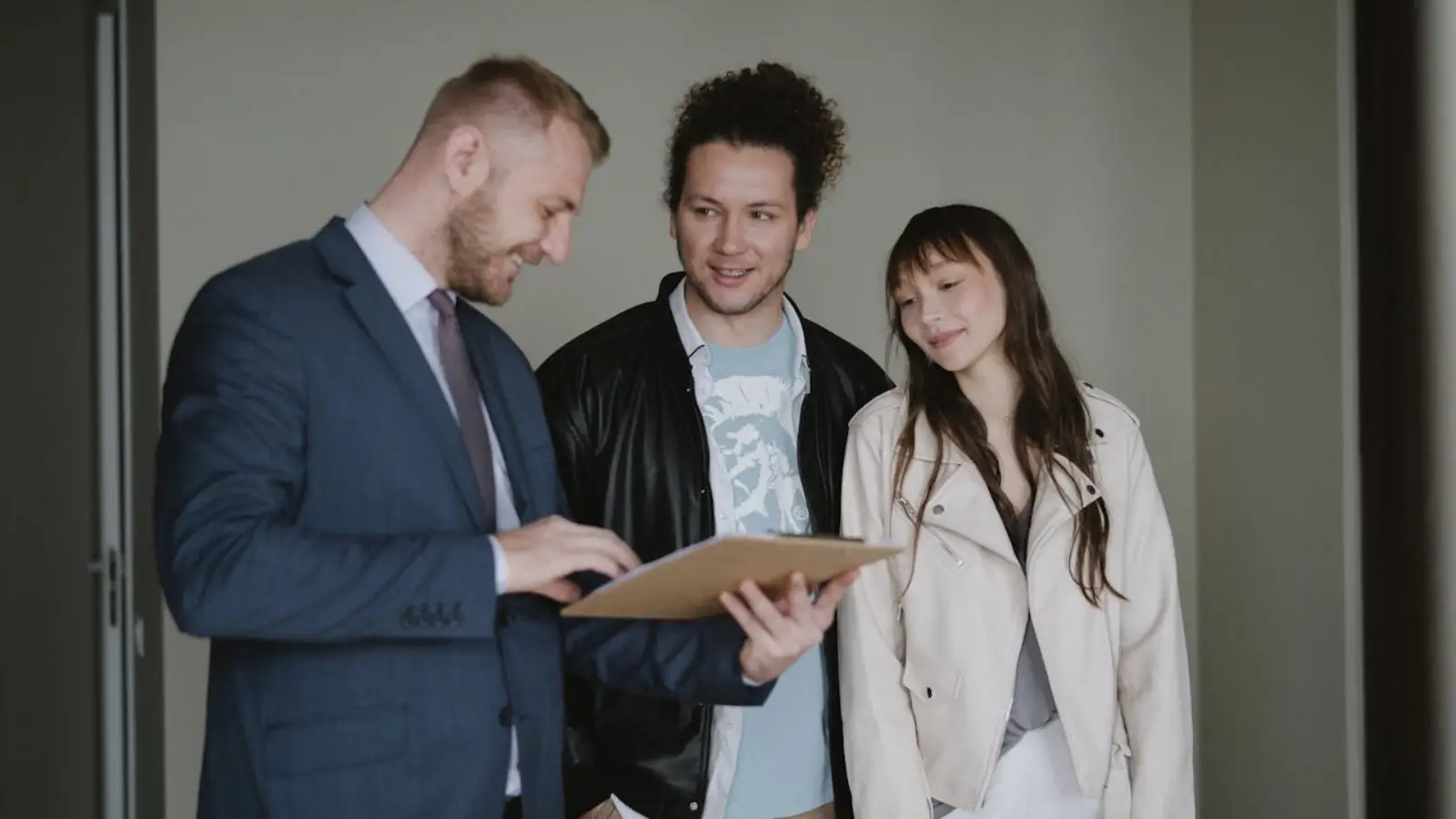 Happy homeowner finalizing fast property sale paperwork