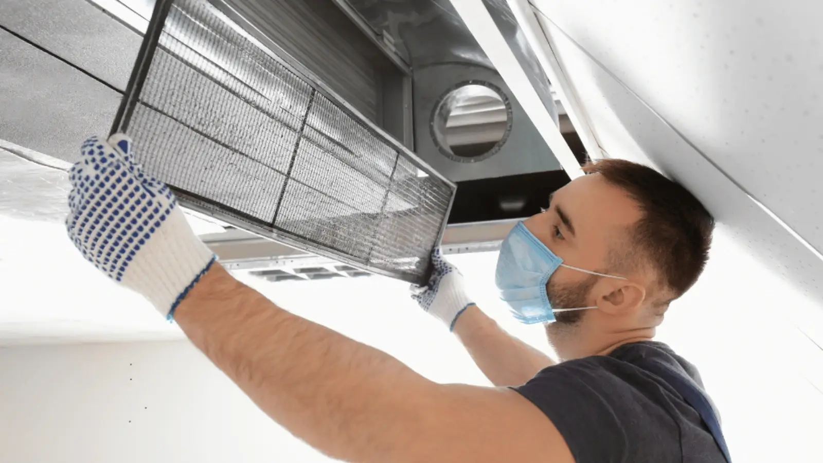 HVAC technician sealing air ducts in a Miami home for improved energy efficiency