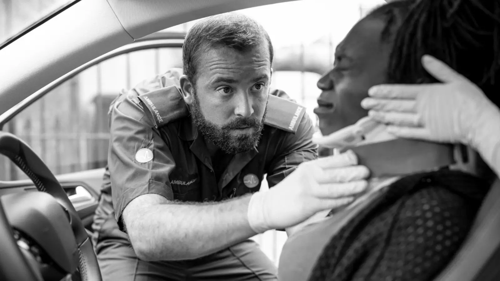 Injured driver holding neck after a rear-end collision in Los Angeles