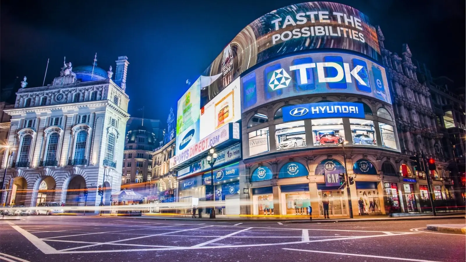 Large storefront wide signage with bold branding and vibrant colors attracting foot traffic