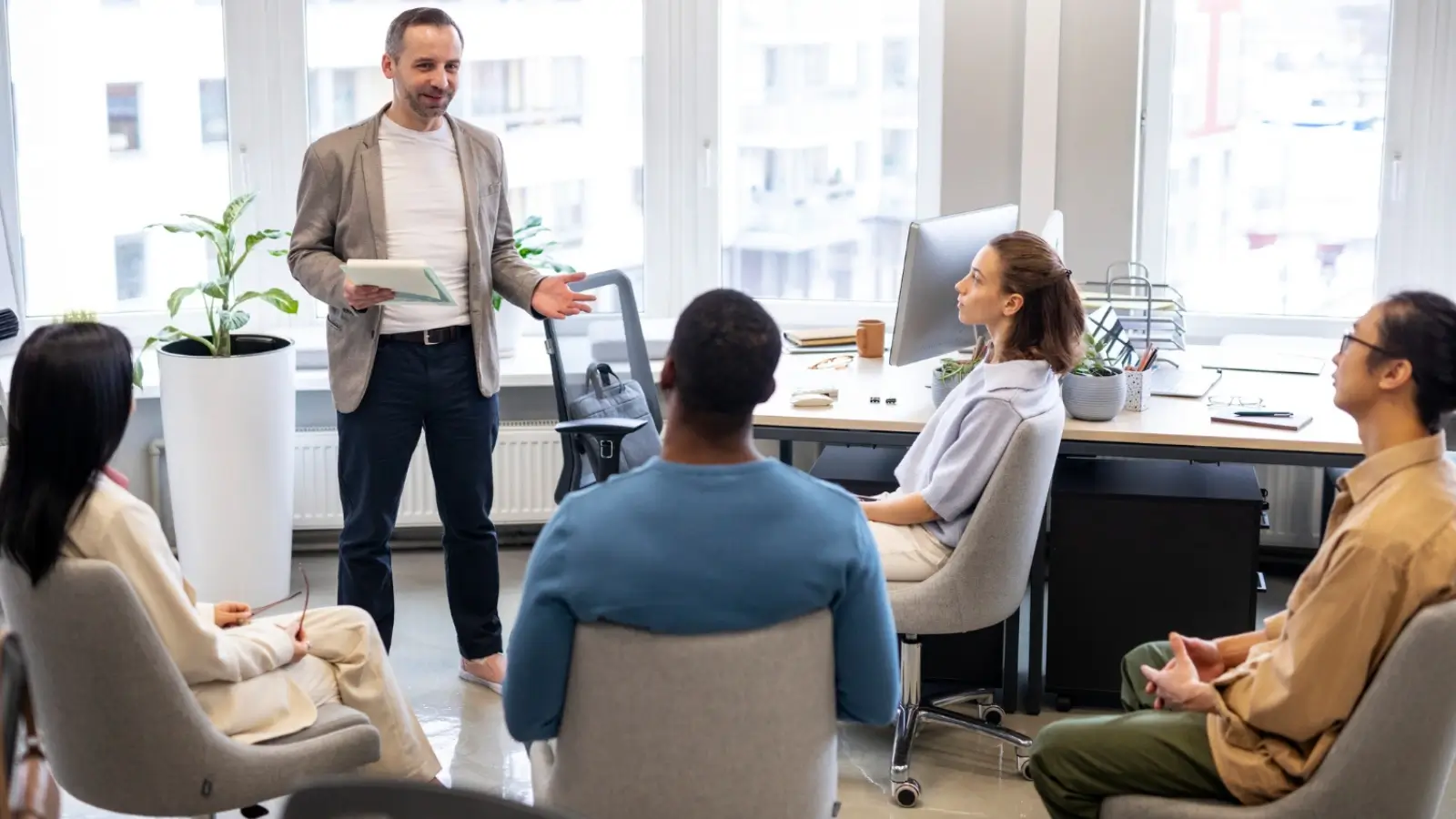 Leader guiding a team during a communication training workshop