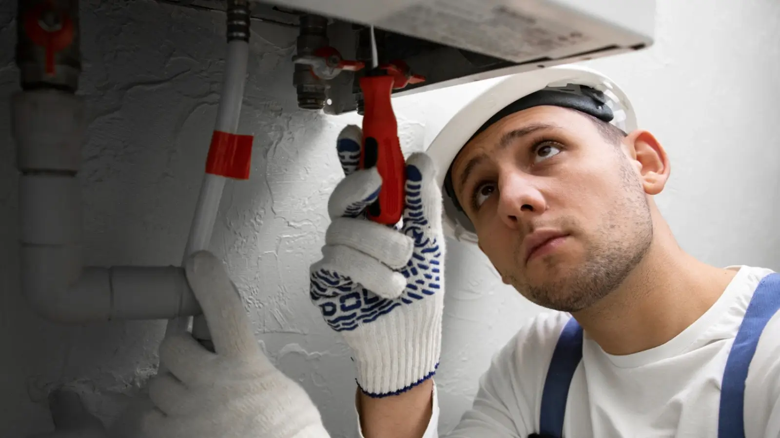 Local plumber in Adelaide repairing a residential hot water system