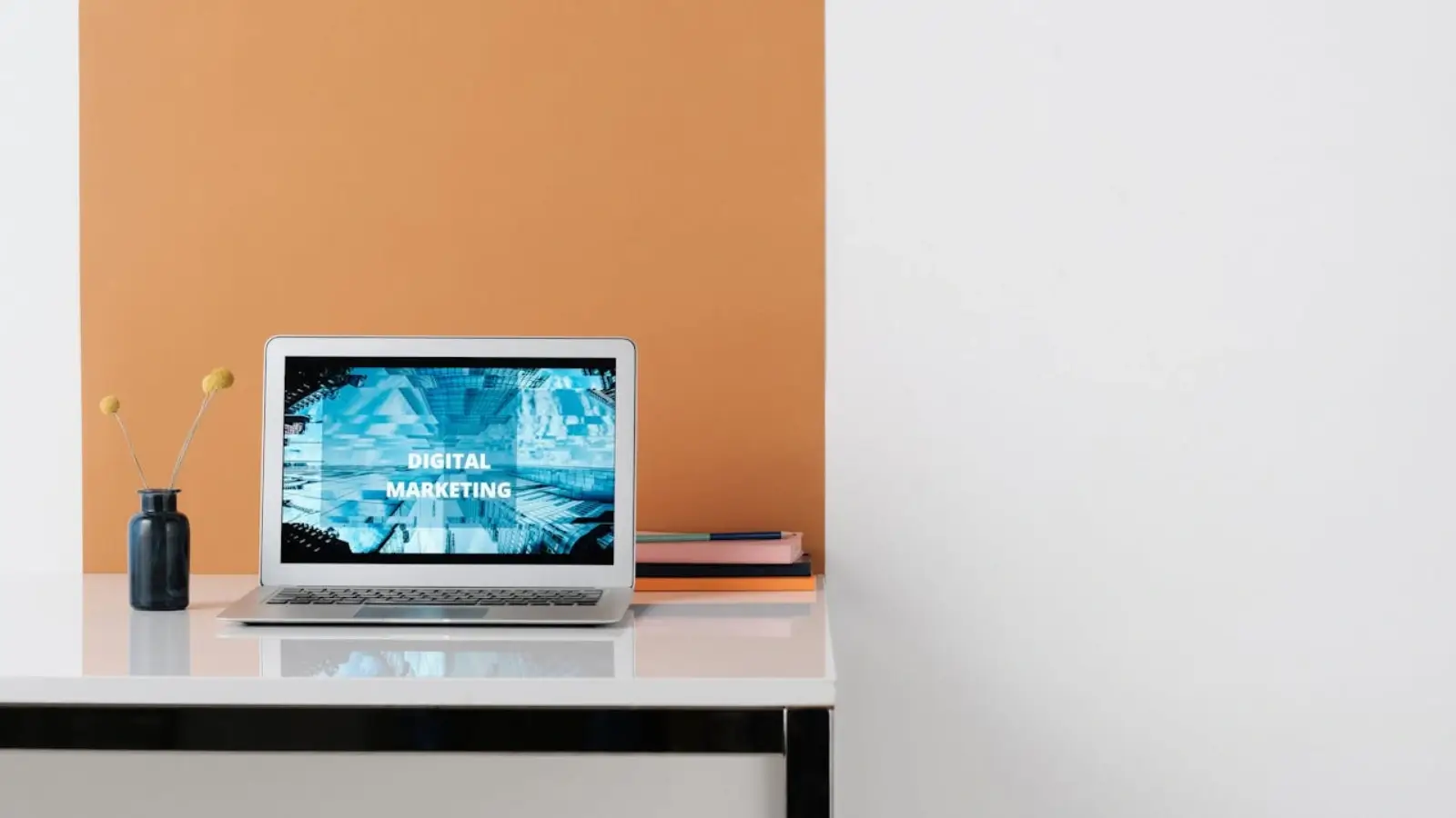 Marketer analyzing digital content strategy with mobile and desktop dashboards